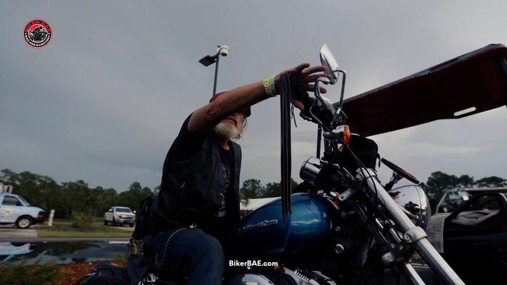 Man on blue motorcycle