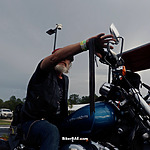 Man on blue motorcycle