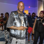 Person wearing a custom black leather vest featuring a large tribute to DMX at the 23rd Annual Florida State Ruff Ryders State Weekend in Kissimmee, Florida.